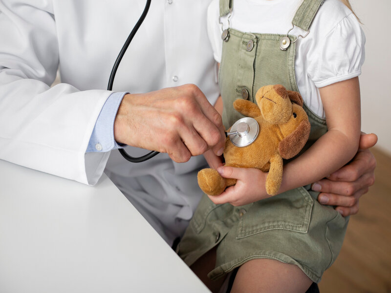 Child with toy in the clinic